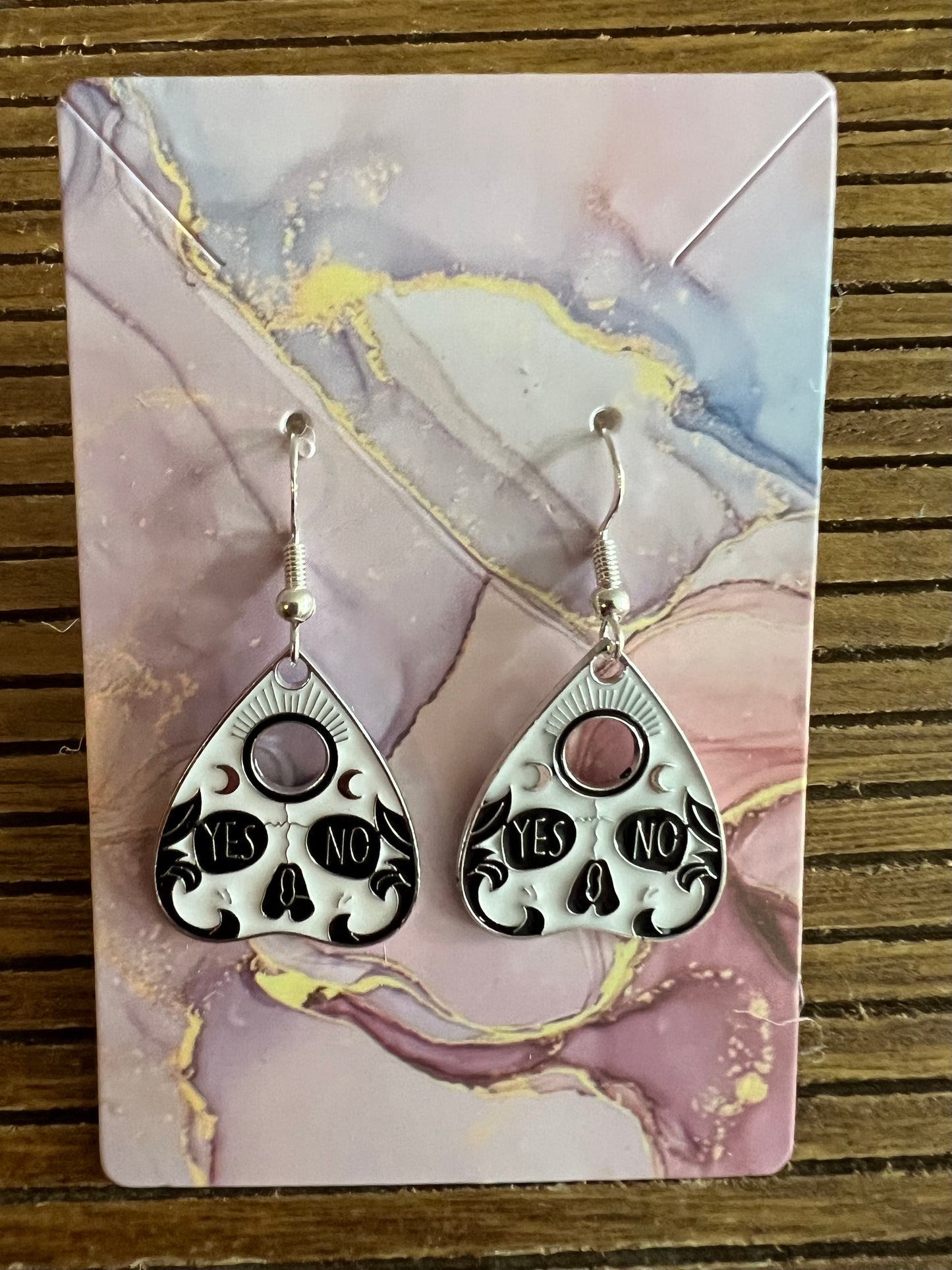 Enamel earrings on ouija board design with skull and yes or no design