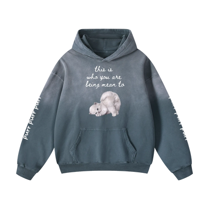 Blue hoodie with a cat illustration and text on a white background