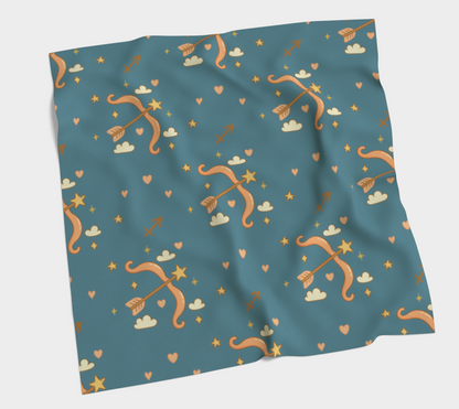 Teal fabric with archery pattern on a light gray background