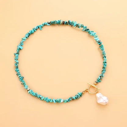 Turquoise stone necklace with pearl pendant and toggle