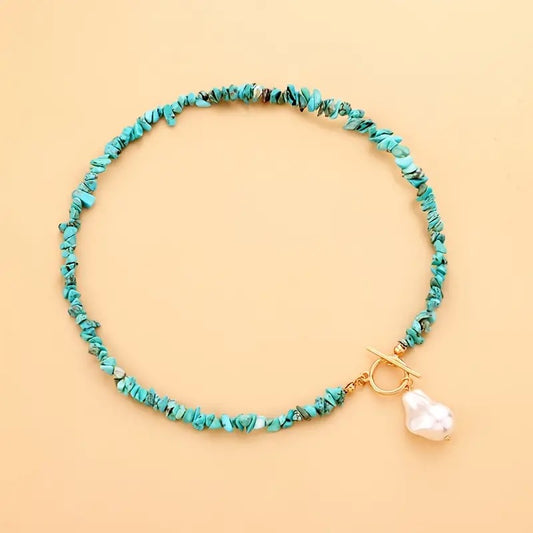 Turquoise stone necklace with pearl pendant and toggle