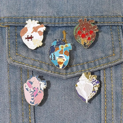 Artistic human heart shape enamel pin in several styles on jeans jacket