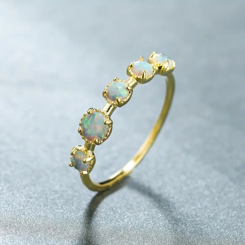 Opal golden ring with 5 stones