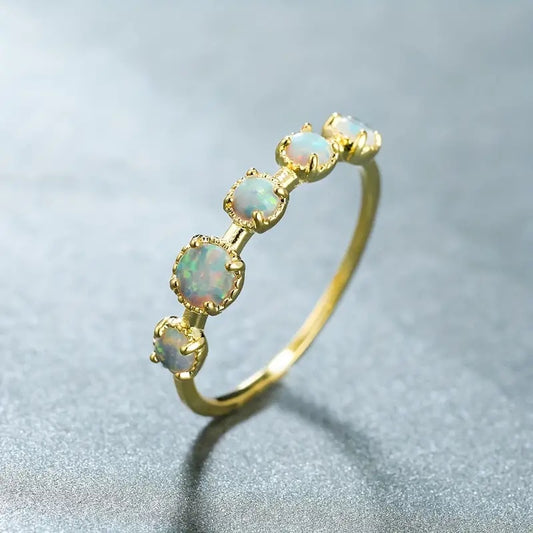 Opal golden ring with 5 stones