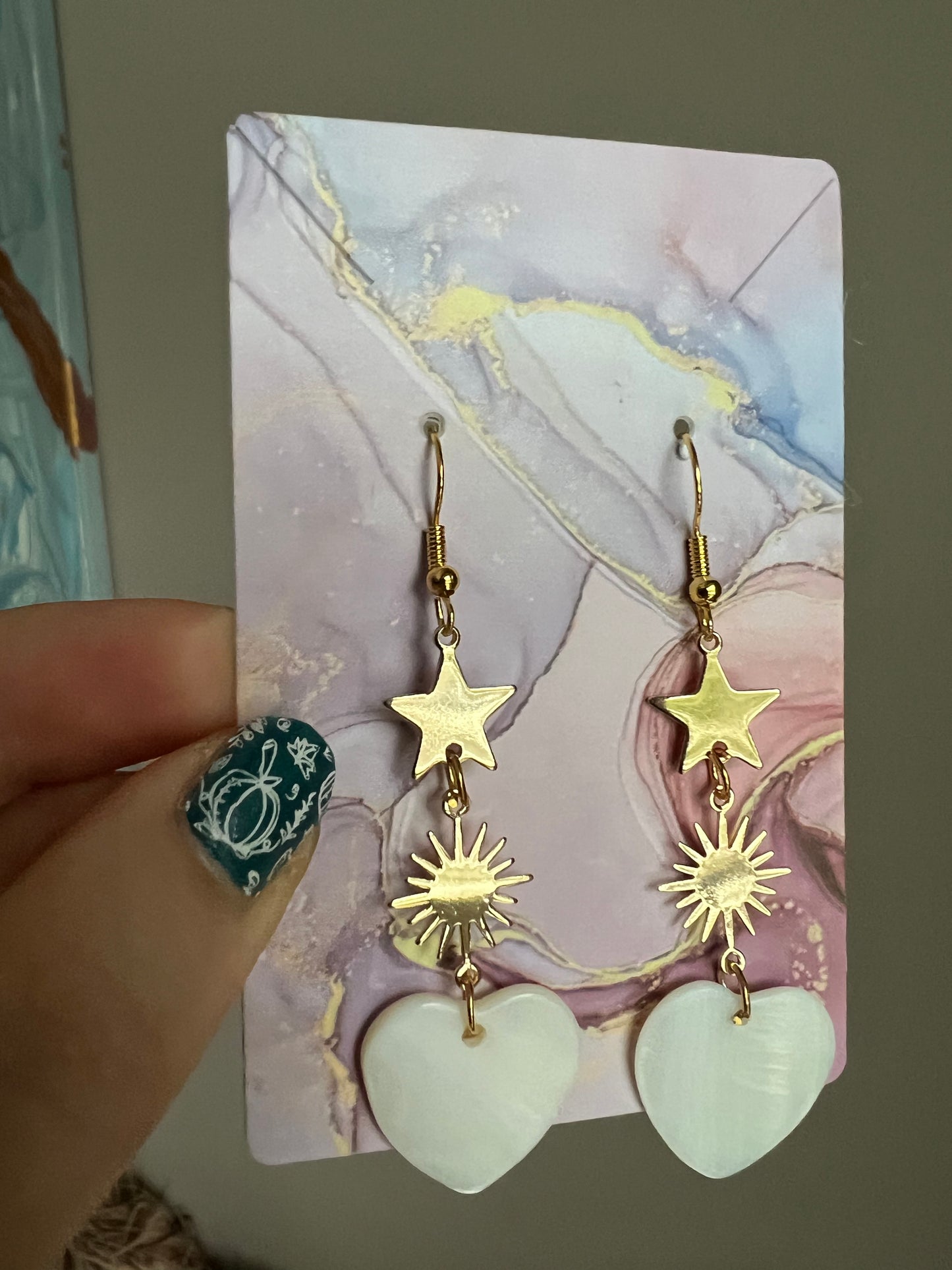 Gold-plated handmade drop earrings with mother-of-pearl heart pendant