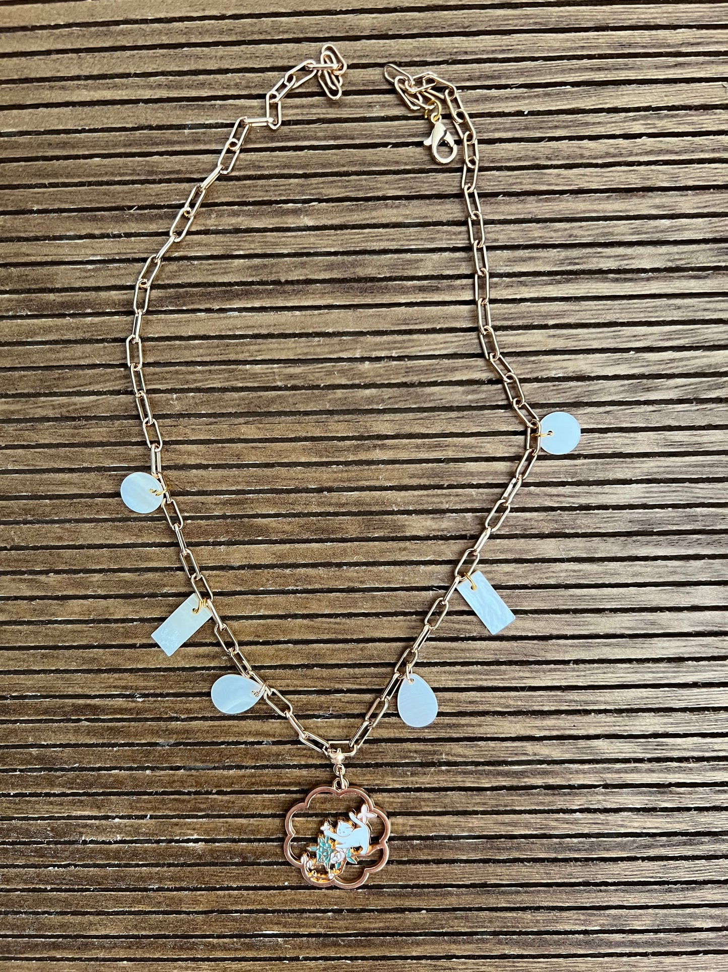 Chain handmade station necklace with cat pendant and natural shell charms