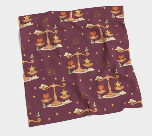 Folded fabric with Libra zodiac pattern on a plain background