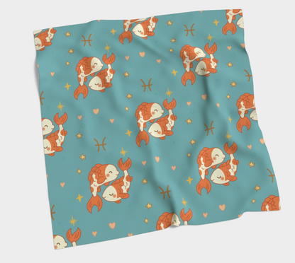 Teal fabric with mermaid pattern on a white background
